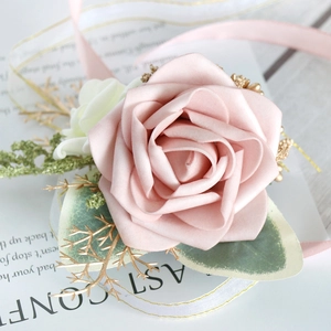 Pink faux rose wedding boutonniere with gold leaves and elegant satin ribbons