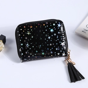 Close-up of black glossy mini wallet with reflective star pattern and tassel charm