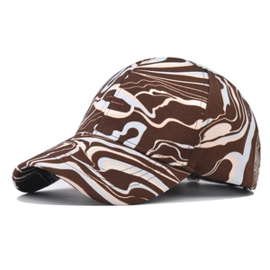 Close-up of the outdoor baseball cap featuring marble tie-dye print and stitched curved brim