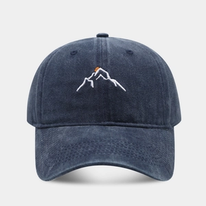 Washed navy cotton baseball cap featuring sunset mountain embroidery on front view