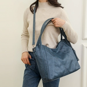 Blue soft PU leather large tote bag with woven texture and tassel charm detail