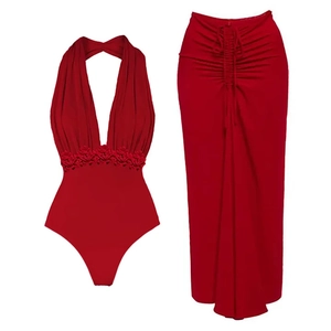 Detail of burgundy deep V neck bodysuit with 3D floral accent and ruched maxi skirt