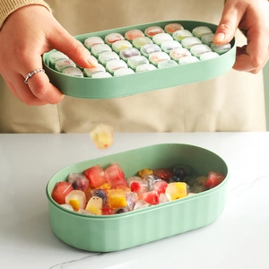 Silicone ice cube tray with storage box being twisted for easy release of ice cubes
