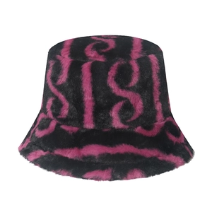 Winter plush bucket hat with retro pink and black wave patterns for warm outdoor wear