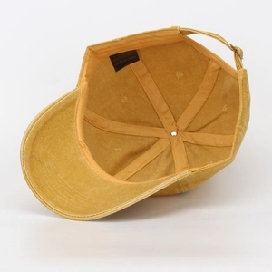 Detail of a washed cotton baseball cap showing internal structure and fabric label