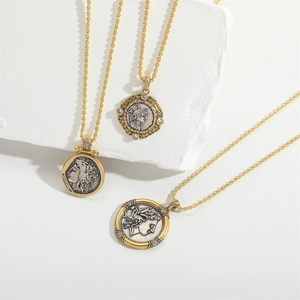 Retro vintage coin pendant necklace with gold and silver tones and white crystal accents