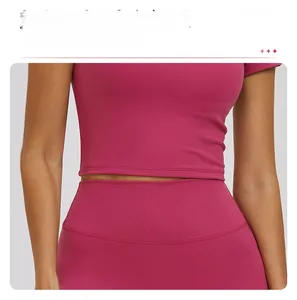 Detail of slim-fit ribbed yoga top with long hem for tummy control and sculpting