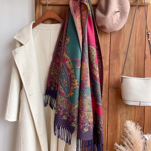 Ethnic style paisley jacquard scarf in deep green and red with soft fringe tassels