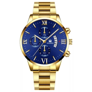 Macro detail of gold stainless steel watch face with Roman numerals and blue dial display