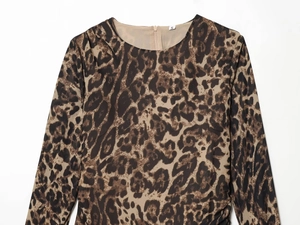 Detailed view of round neckline with size S tag and leopard print fabric texture