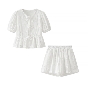White cotton two-piece summer set with floral embroidery and tie-front top with shorts
