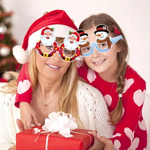 Funny Christmas themed glasses featuring Santa Claus and snowman designs for festive parties