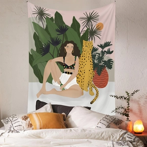 Artistic tapestry showing woman and cheetah with tropical leaves in a bedroom setting