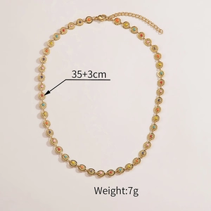 Detail of gold chain necklace with colorful beads showing 35+3cm length and 7g weight
