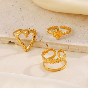 Set of three adjustable gold stainless steel rings with heart and star motifs on stone
