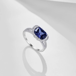 Macro shot of S925 sterling silver ring with blue rectangle gem and sparkling zircon