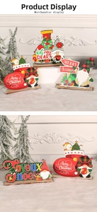 Close-up of wooden Christmas gnome desktop ornaments with Merry Christmas lettering