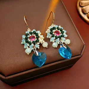 Vintage flower heart earrings with colorful beads and blue crystal pendant on leather