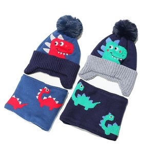 Kids dinosaur knit hat and scarf set with pom poms for boys in navy and royal blue