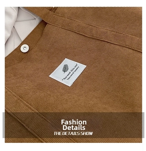 Close-up of brown corduroy bag texture with white leaf label and magnetic clasp