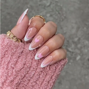 Pink heart almond press-on nails with white French tips and gold rings accessory