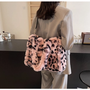 Pink leopard print plush shoulder bag showing generous capacity and soft faux fur texture