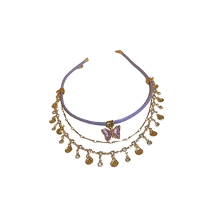 Layered choker necklace featuring purple leather, gold chains, and a purple butterfly pendant