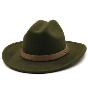 Detail of dark green fedora hat featuring brown leather band and gold rivet accents