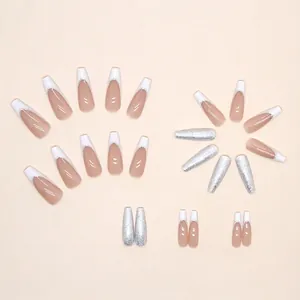 Long coffin press-on nails with white French tips and sparkling silver glitter finish