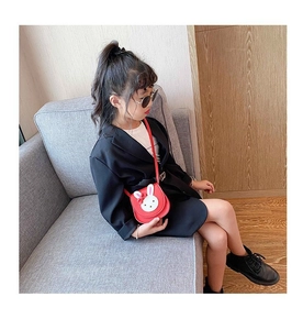Detail of red cartoon bunny crossbody bag with white rabbit appliqué for little girls