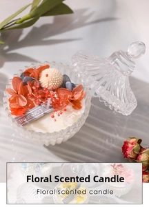 Close-up of dried flowers decoration on scented soy candle in embossed glass jar