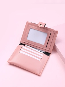 Internal view of pink PU leather card holder showing multiple slots and photo window