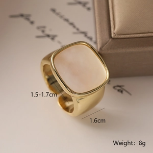 Macro shot of 18K gold plated square ring with mother of pearl inlay and open band