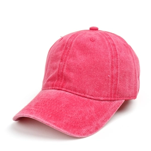 Detailed view of the washed vintage texture and stitching on this rose red baseball cap