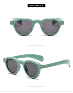 Detail view of mint green retro sunglasses featuring metallic hinges and gold rivets