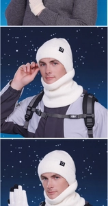 Close-up of white knit winter set including beanie, neck warmer, and touchscreen gloves