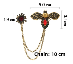 Detail showing vintage bee and flower brooch sizes with 10cm golden chain length