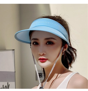Detail of light blue sun visor with large brim and DESIGN ENJOY SUNSHINE lettering