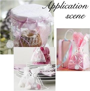 Spiral spring bead cage pendants shown decorating gift bags and glass jars for DIY crafts