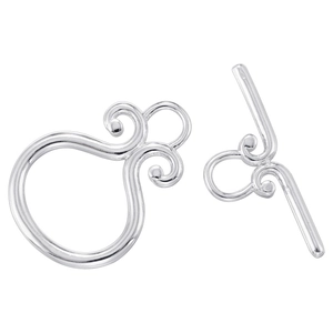 Macro view of silver vintage OT toggle clasp with intricate scroll patterns for jewelry