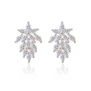 Macro detail of leaf-shaped marquise cut zircon drop earrings with gold-tone plating