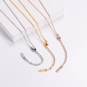 Detailed view of titanium steel necklaces in gold, silver, and rose gold with lobster clasps