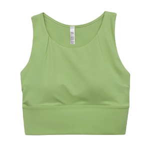 Dettaglio delle coppe integrate e delle cuciture elastiche sul top da yoga verde