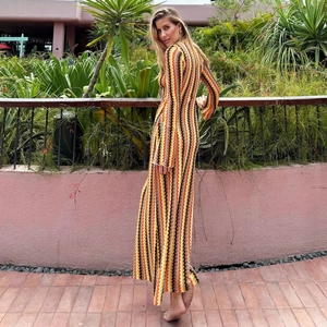 Detail of slim fit V-neck knit maxi dress with colorful zigzag wave patterns