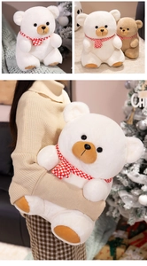 Close-up of cute teddy bear with red plaid scarf and soft plush fur detail