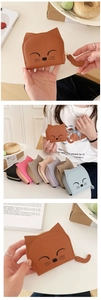 Detailed view of cat-shaped wallets in various colors with embroidery and tail zipper pulls