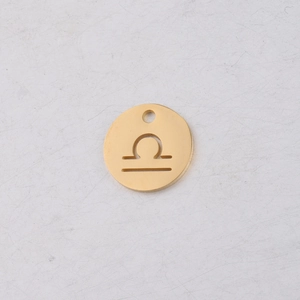 Macro shot of 12mm golden stainless steel Libra constellation pendant with cutout design