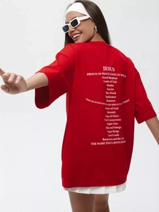 Back view of red oversize cotton t-shirt with white Jesus text graphic print