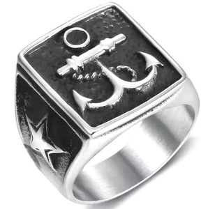 Macro view of vintage stainless steel ring with anchor relief and star detail