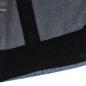 Close-up of denim baseball cap interior featuring black sweatband and reinforced stitching
